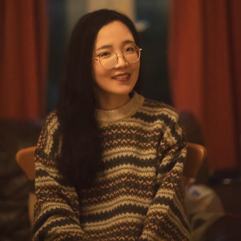 Image of Xinyi Zhao sitting down