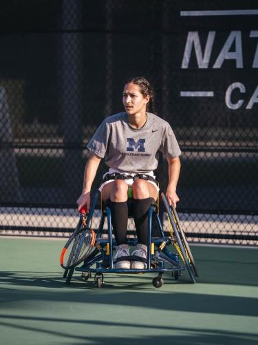 Image of Dakota J Betts playing wheelchair tennis