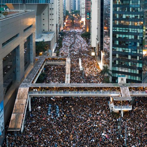 Crowds of people fill the street during a protest in Hong Kong