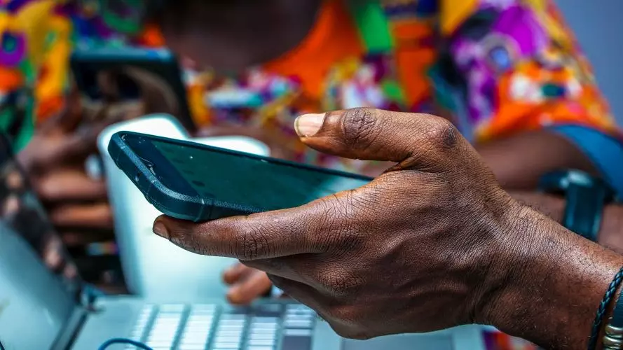 Image of someone holding a mobile phone