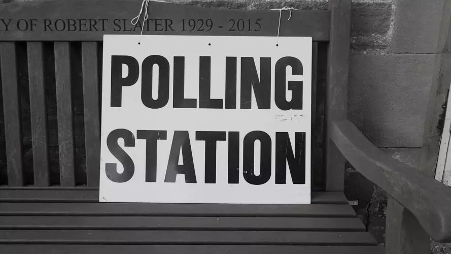 Polling Station sign on wooden bench