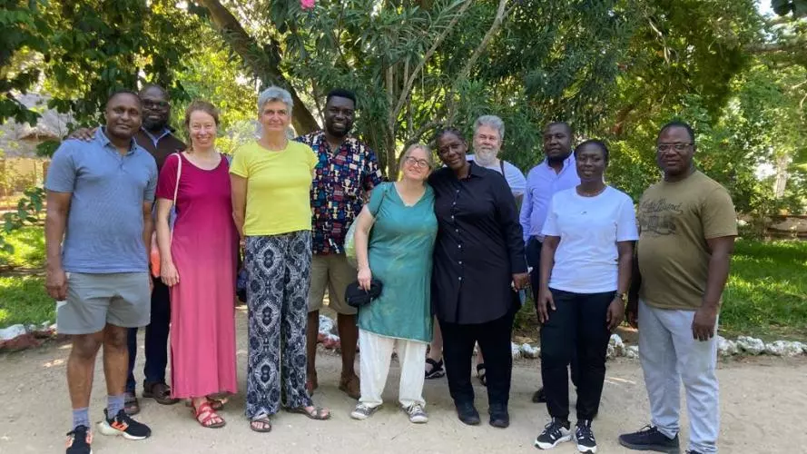 Members of the STREAMS project stand outside under the trees