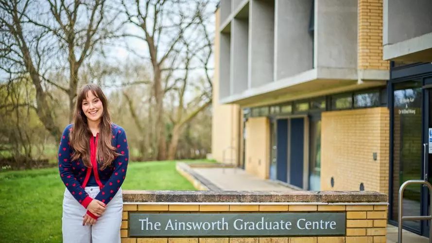 Image of Emma Somos outside of the Ainsworth Graduate Centre