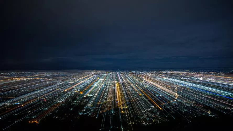 A city at night with blurred light trails
