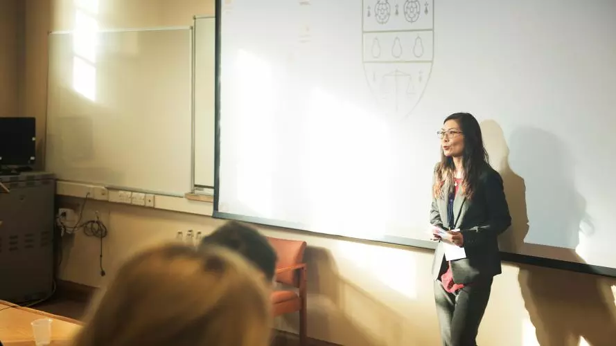Man-Yee Kan giving a lecture to students