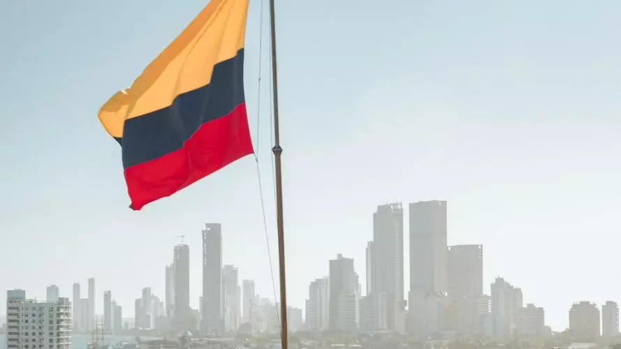 A Colombian flag flies in front of the Cartagena skyline
