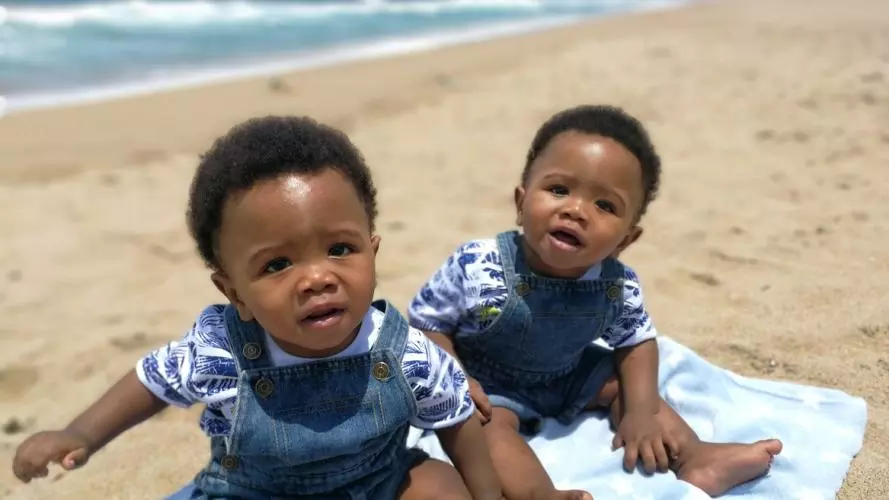 Twin babies at the beach