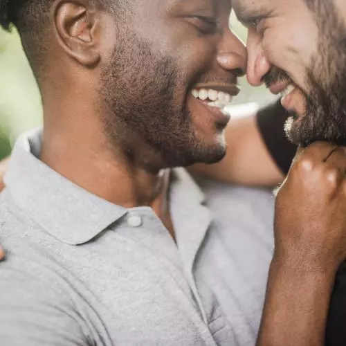 Image of two men embracing 
