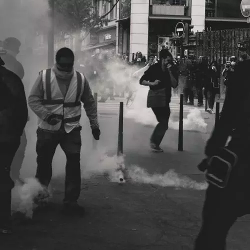 Black & white image of protesters and police