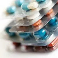 Different coloured pills in packets