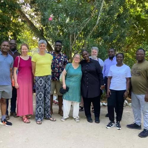 Members of the STREAMS project stand outside under the trees