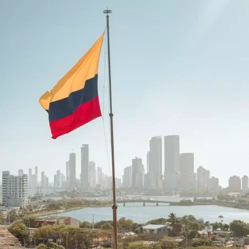 A Colombian flag flies in front of the Cartagena skyline