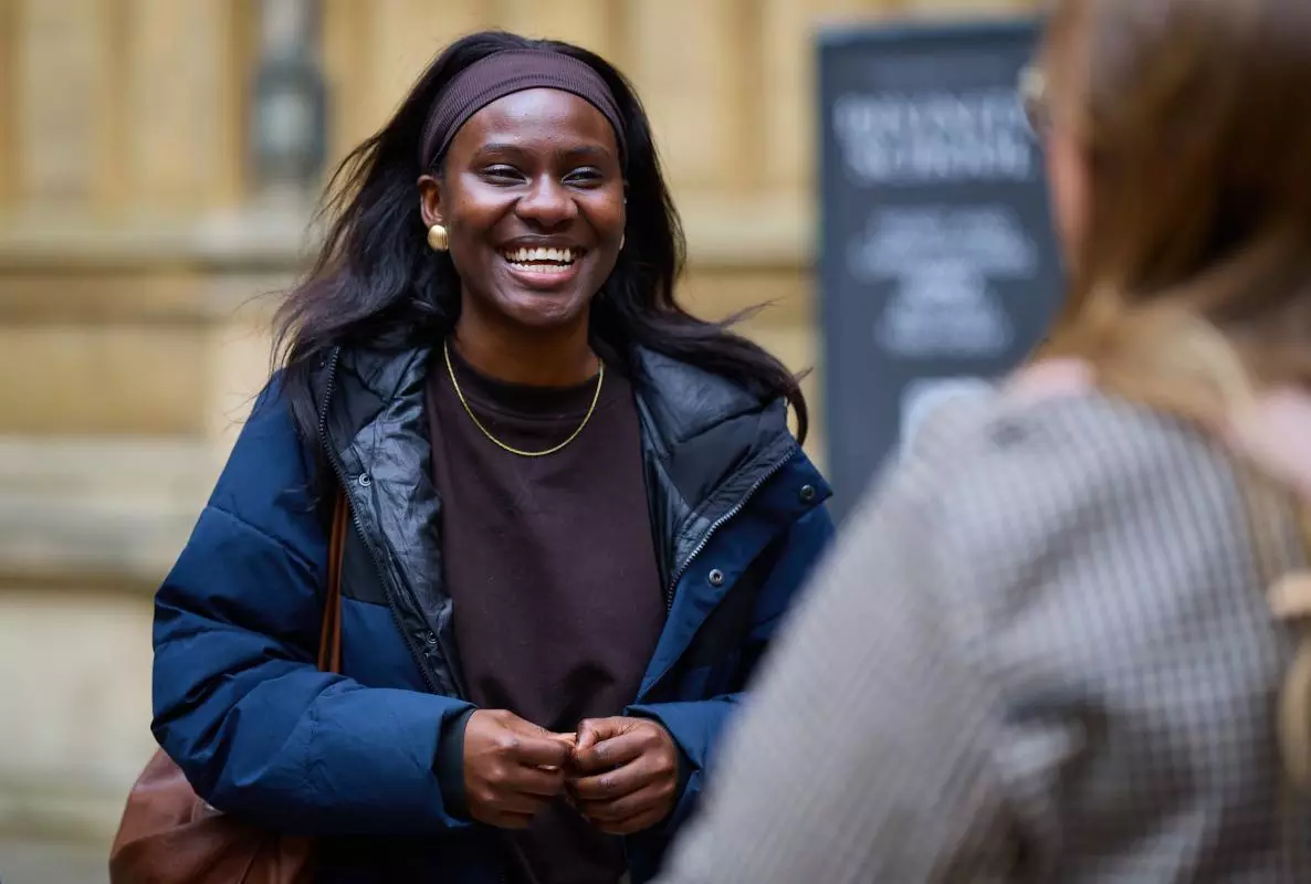 Image of a student in the Old Schools Quad