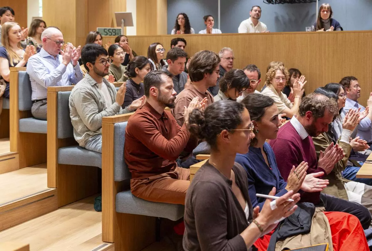 Image of attendees clapping during the Halsey Lecture