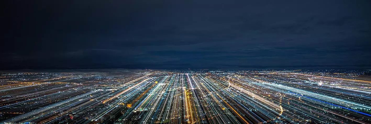 A city at night with blurred light trails