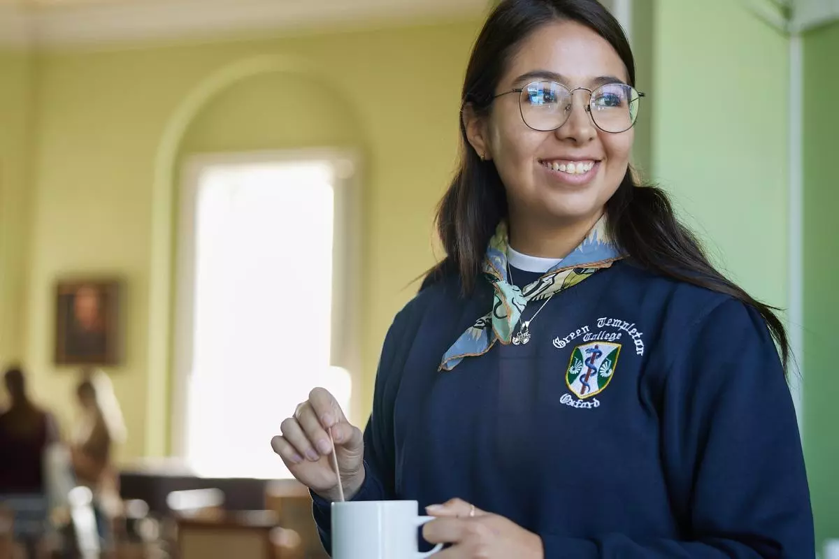 A student makes a cup of tea in college