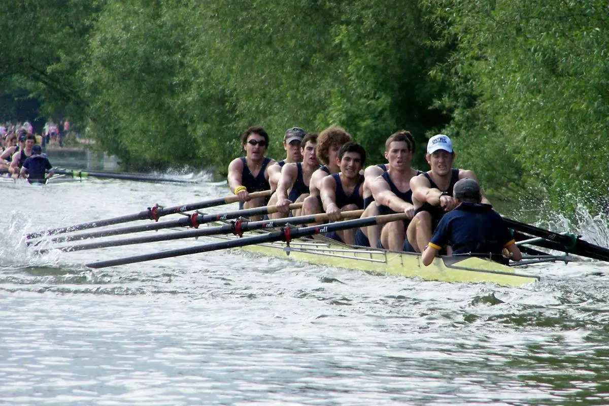 A team of eight men row along one of Oxford's rivers